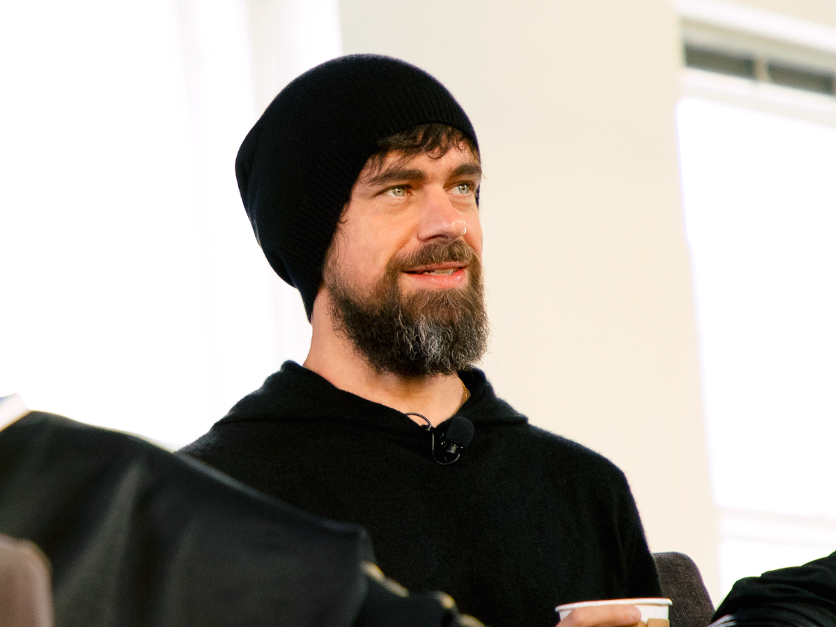 homeless man on street waiting for vaccine
